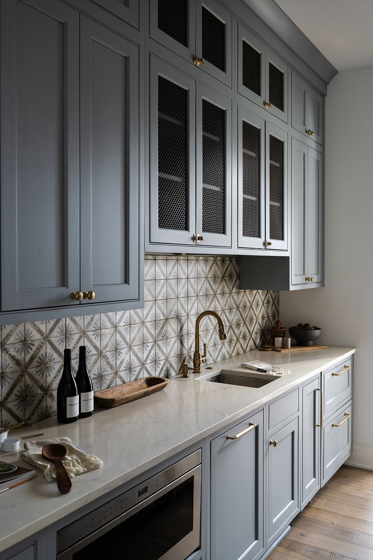 Edgewood butler's pantry with beautiful pattern tile backsplash