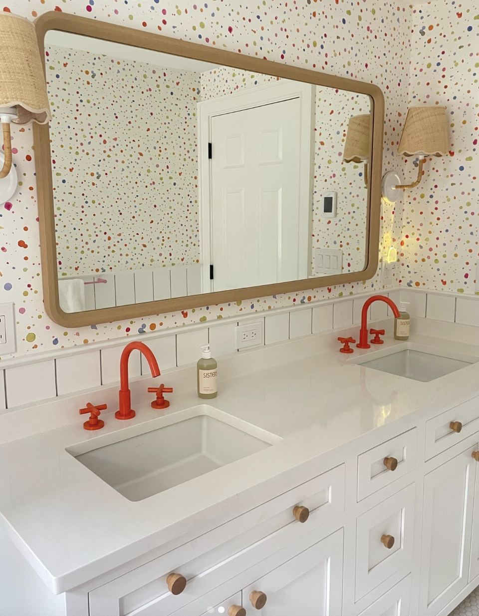 Colorful wallpaper appears in a kids' bath