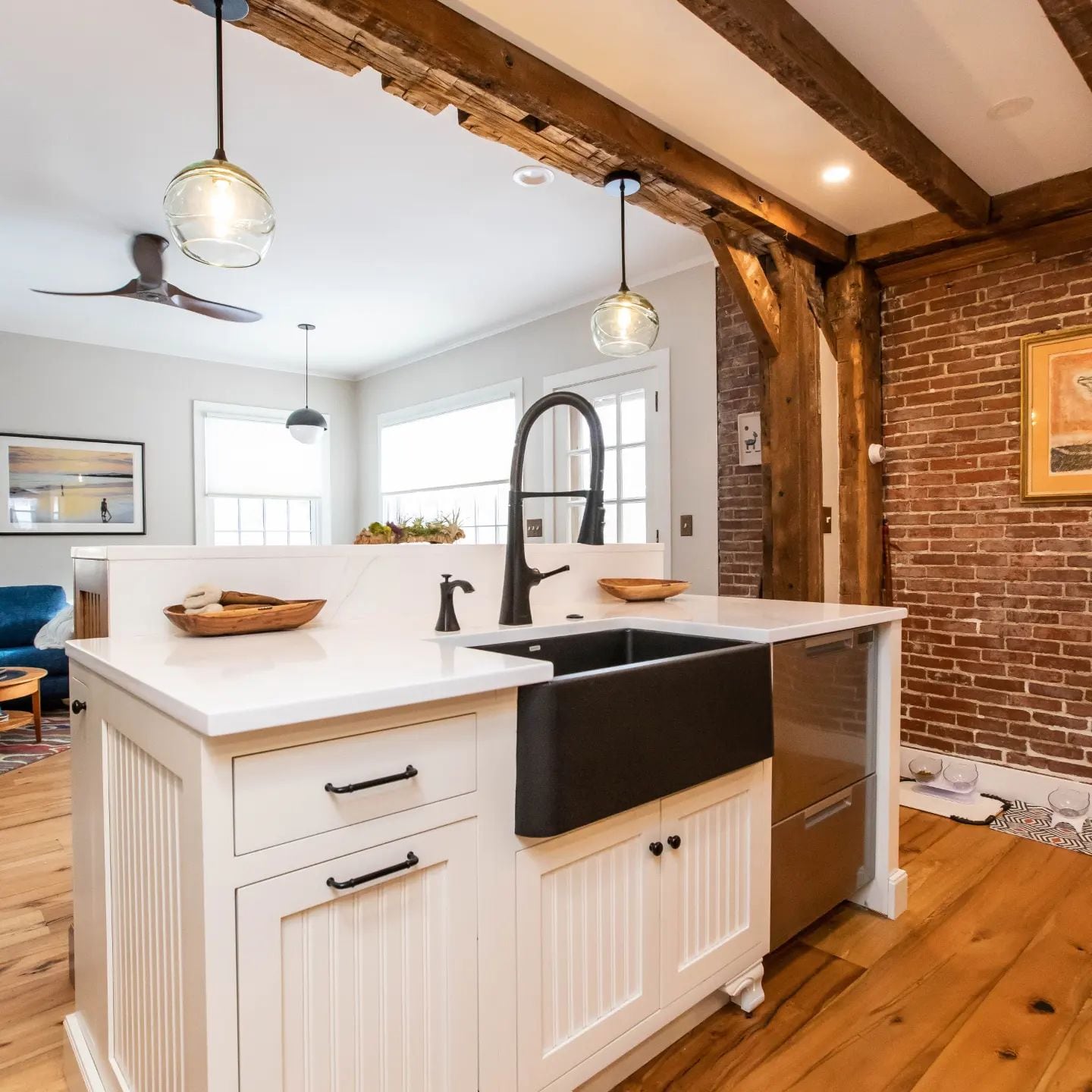 Big bright windows let light in to show off exposed brick