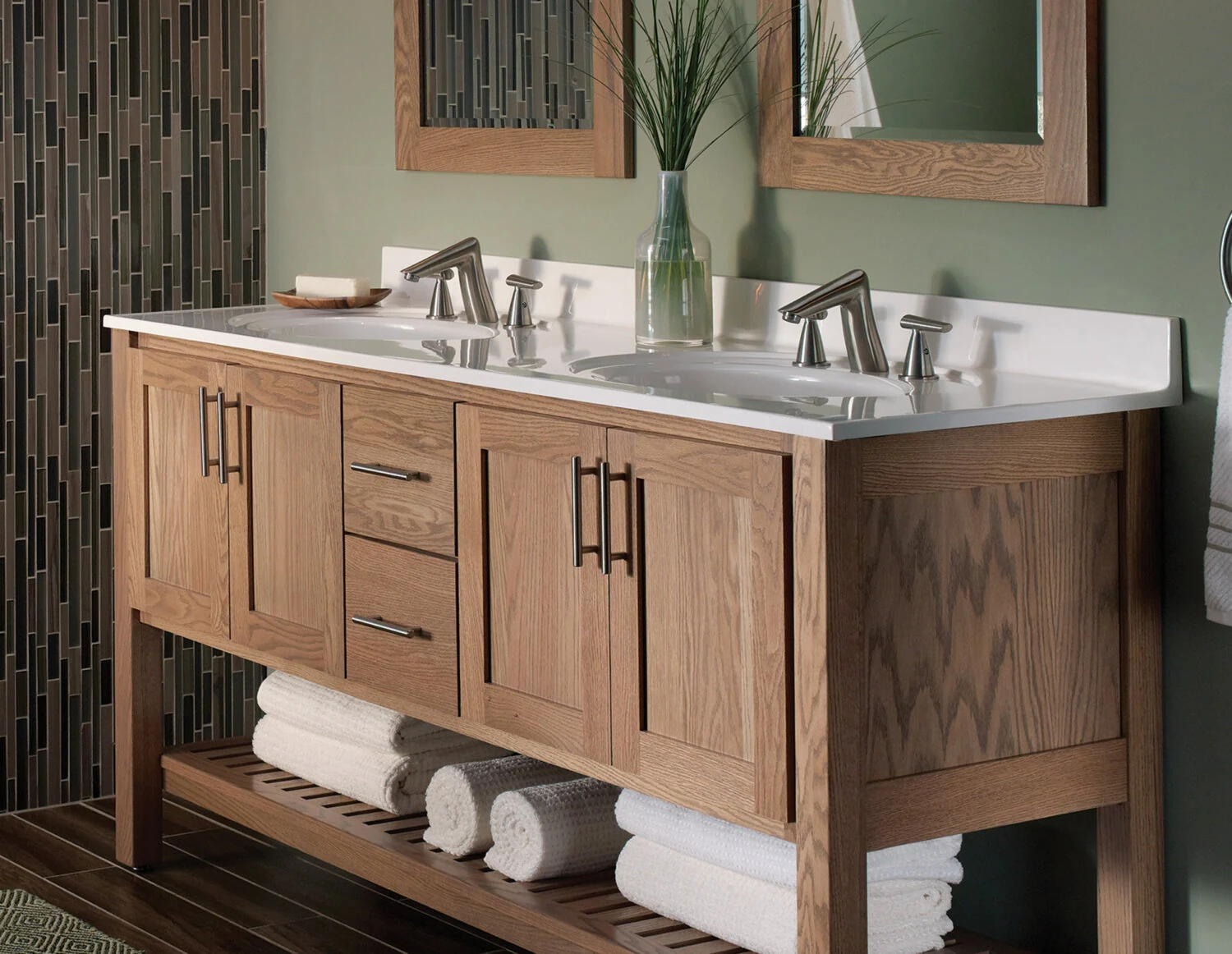 A sleek, transitional style bathroom with a spa-like design featuring a light stained wood vanity with a furniture style and an open shelf below.