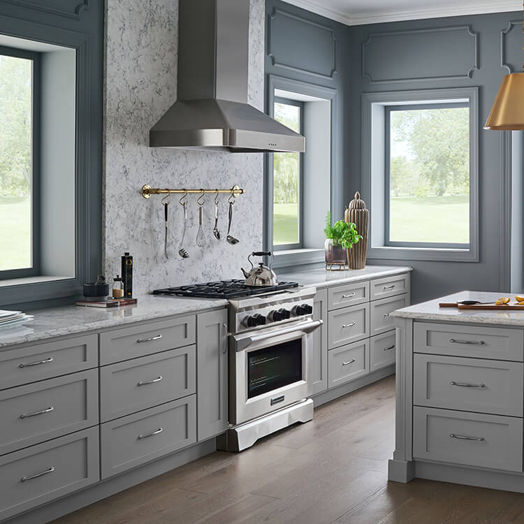 Beautiful grey kitchen with no upper cabinets.