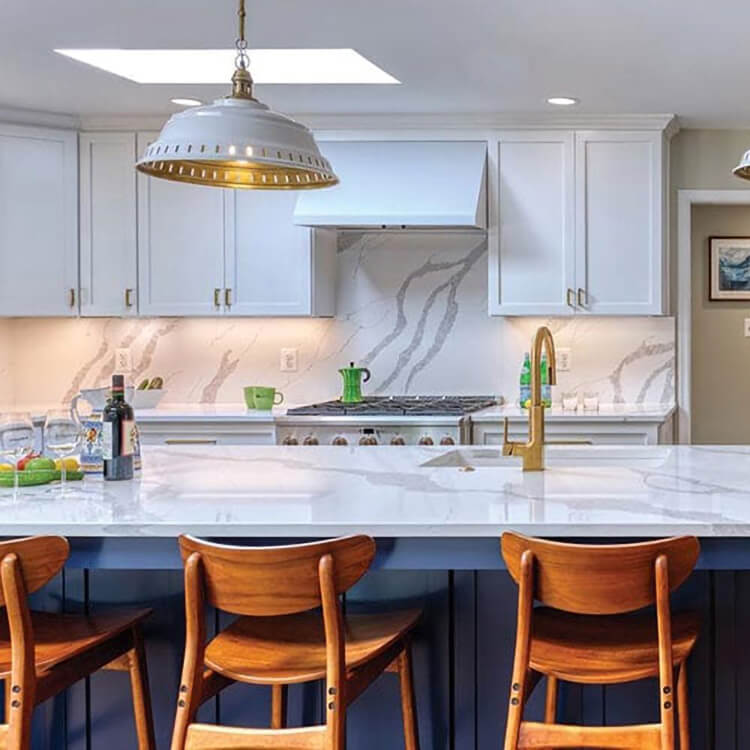Blue and white kitchen cabinets in a newly remodeled kitchen.
