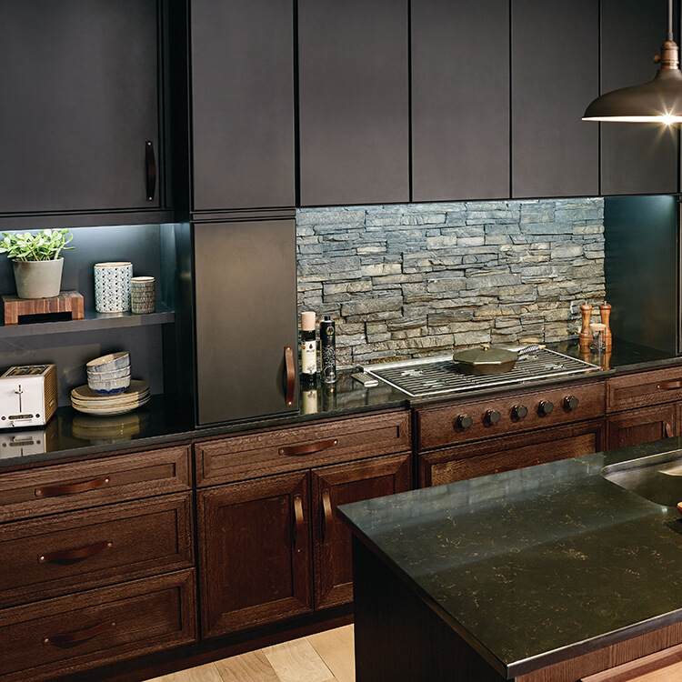 Black and dark brown kitchen cabinets in a modern, industrial kitchen renovation.