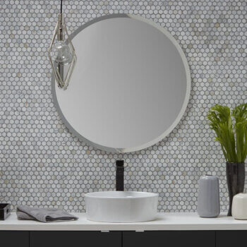 A modern circular, round mirror from Bertch with a beveled edge and no frame.