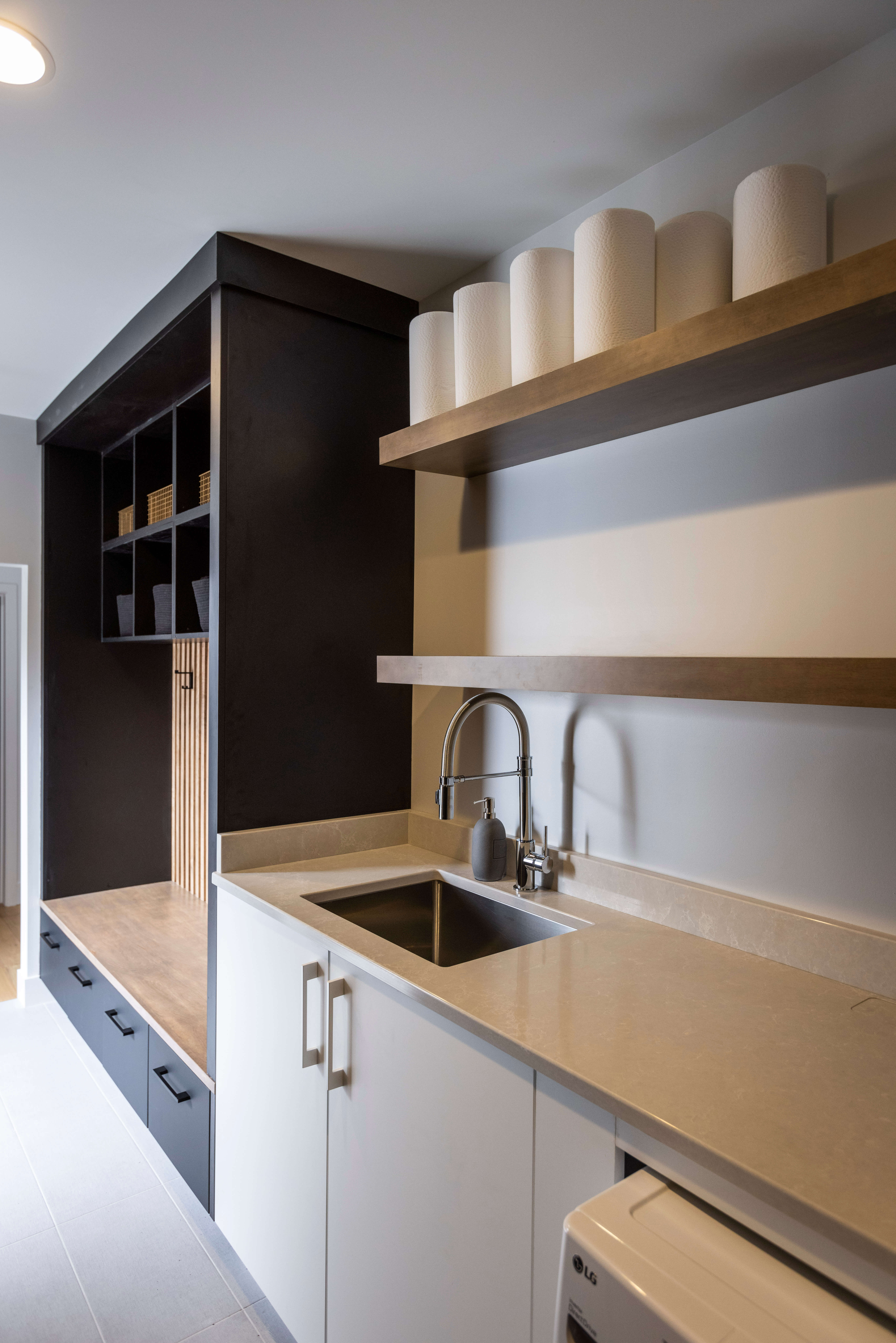 A laundry room example with floating shelves.