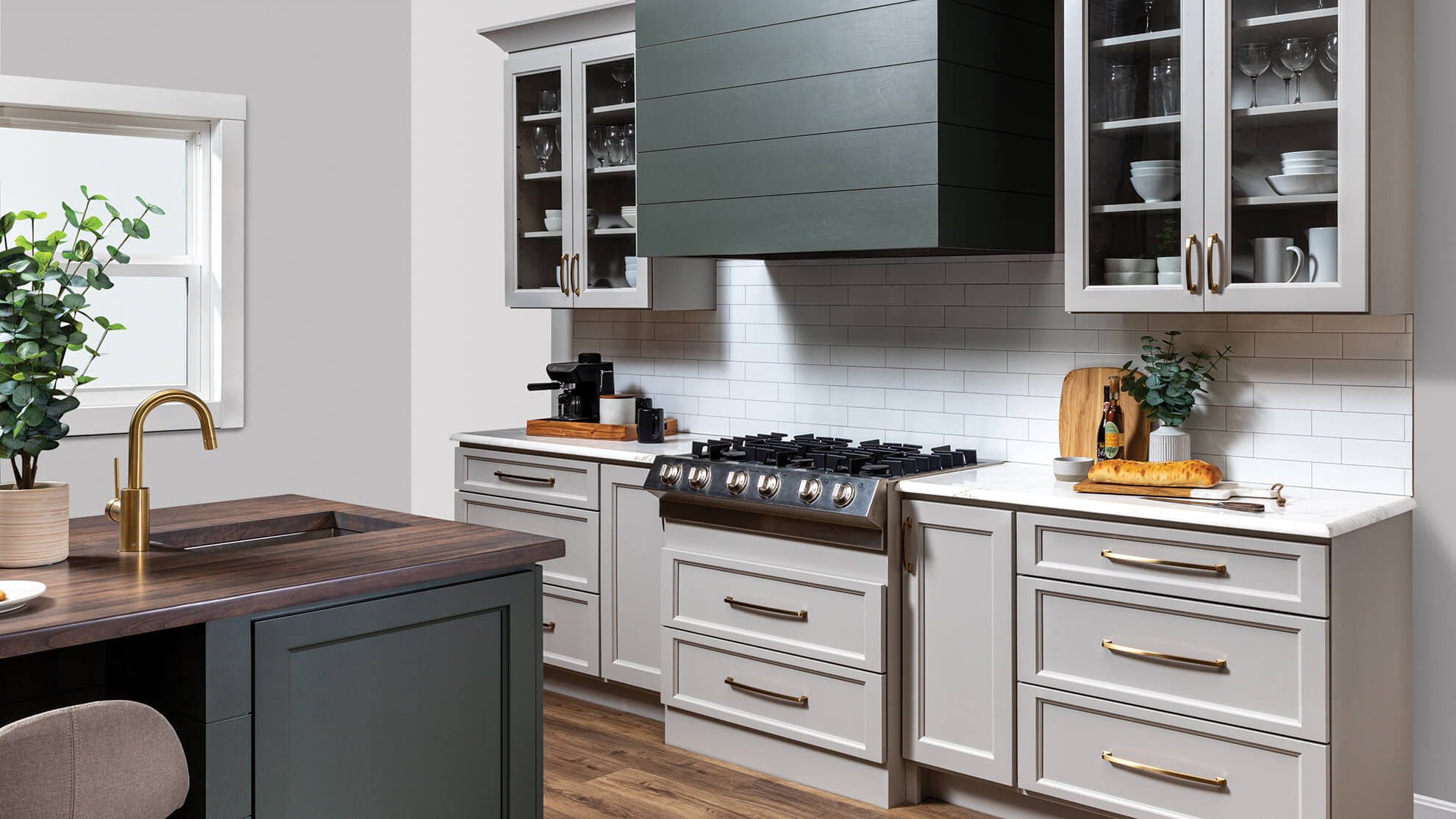 A close up of a modern wood hood with shiplap details and a hunter green painted finish.