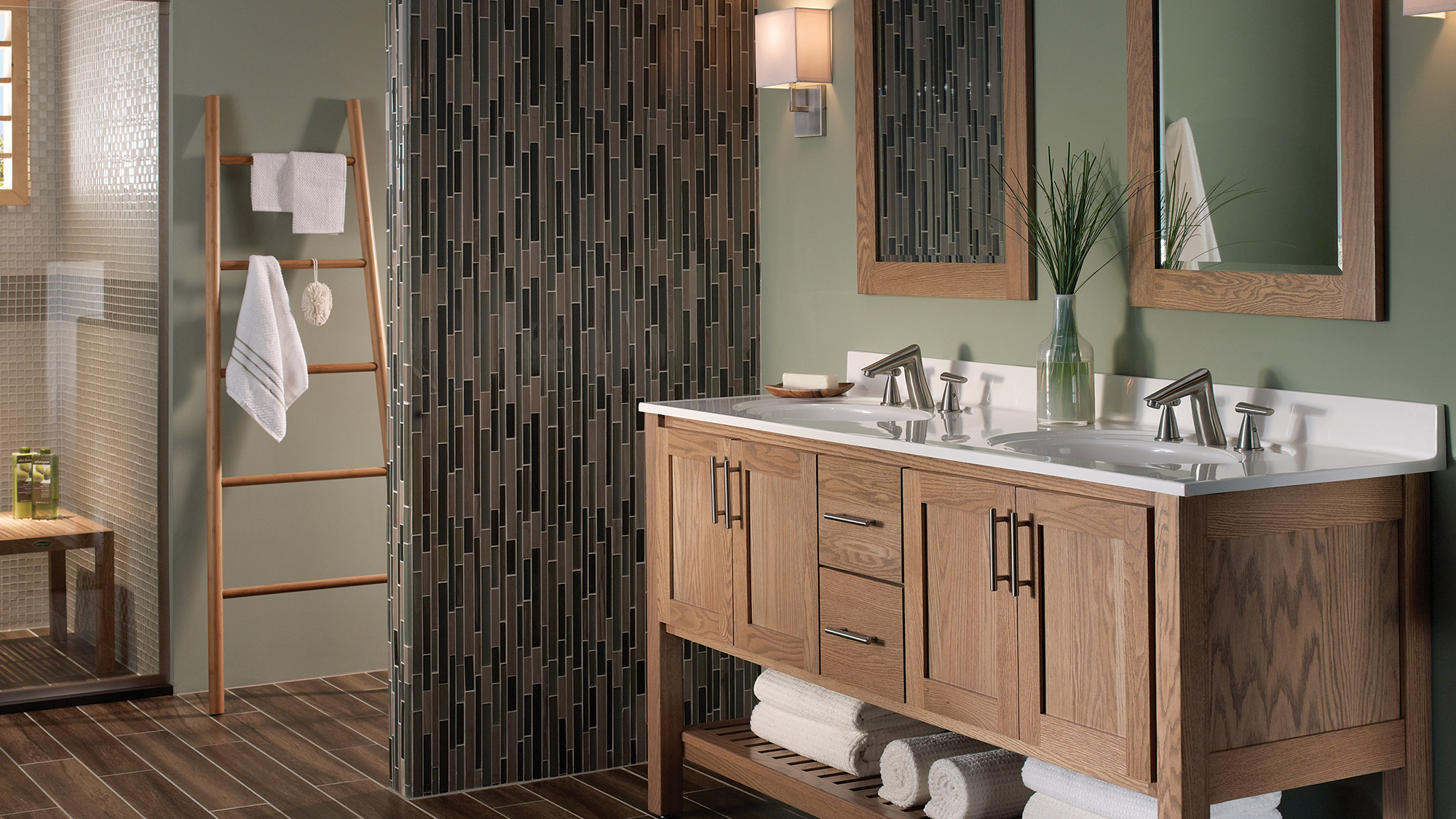 A sleek, transitional style bathroom with a spa-like design featuring a light stained wood vanity with a furniture style and an open shelf below.