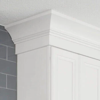 A beautiful and sophisticated beaded cove crown molding for the top of cabinets by Bertch.