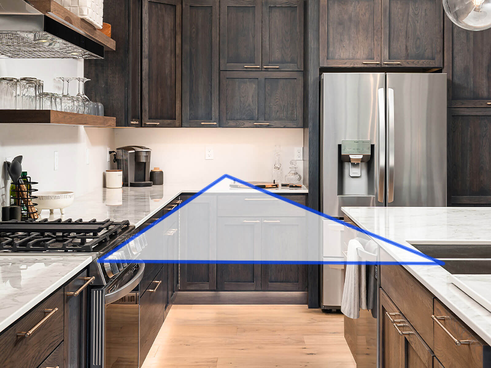 This kitchen showcases a standard work triangle, between appliances, counter, and island