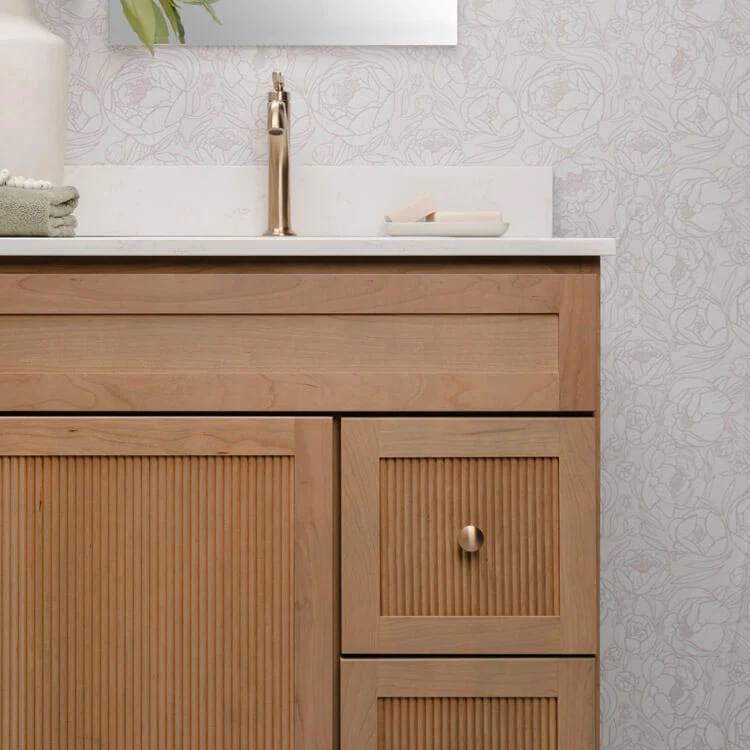 Beautiful reeded vanity with elegant satin champagne bronze hardware.