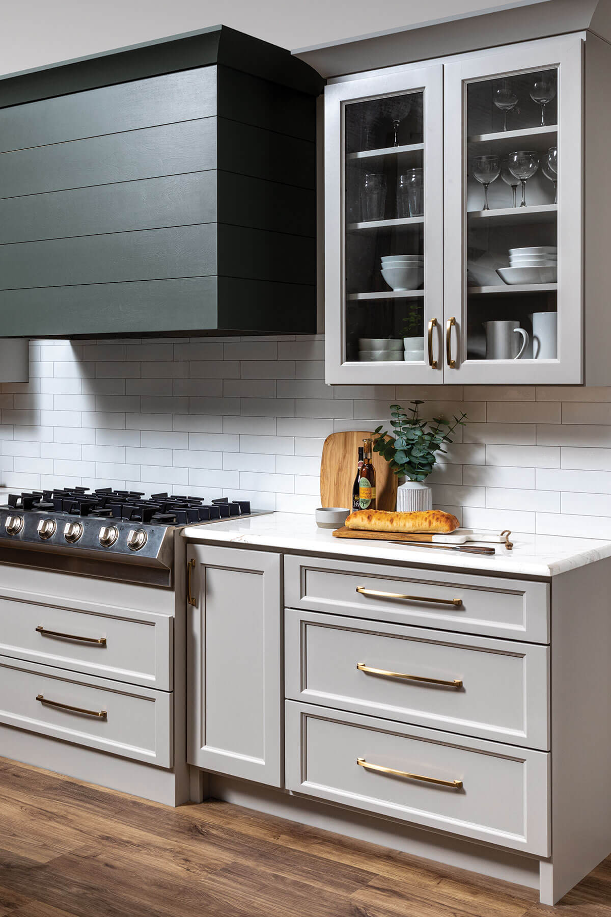 Huntington door style, with solid color Dune shown on base cabinets