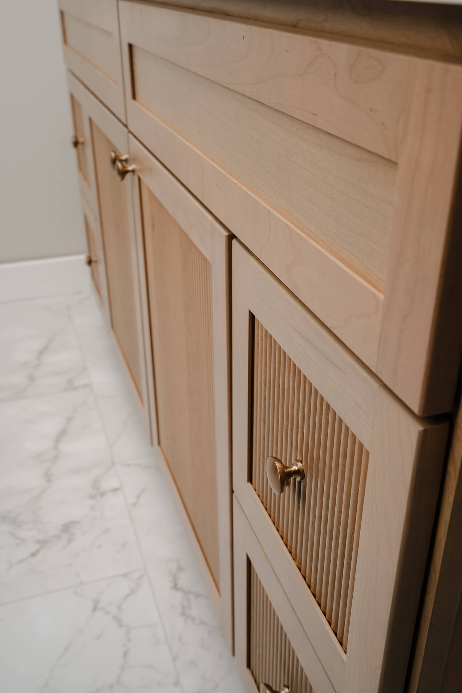 Bertch's much anticipated reeded door style, Reedlyn, shown in Cashew stain on Cherry wood.