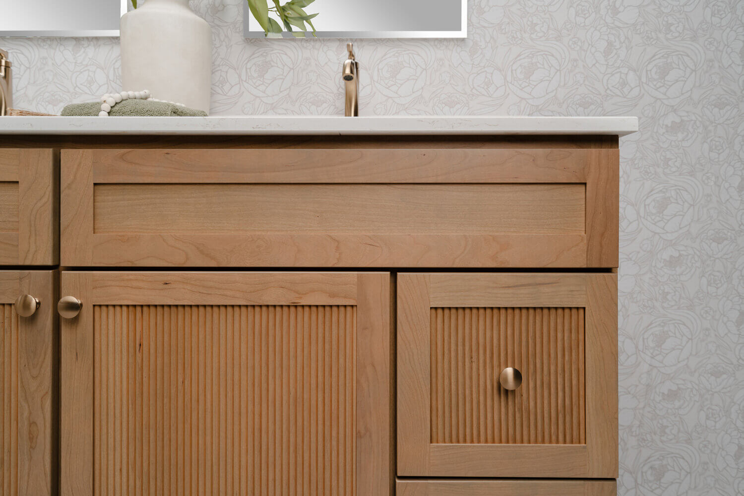 Bertch's much anticipated reeded door style, Reedlyn, shown in Cashew stain on Cherry wood.