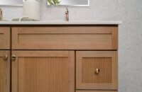 Bertch's much anticipated reeded door style, Reedlyn, shown in Cashew stain on Cherry wood.