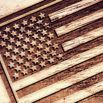 american flag engraved on wood background